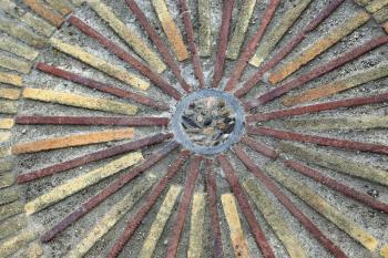 Pavement with granite strips concentric pattern. Patterned floor walkway in the park, Montjuic, Barcelona, Spain