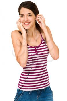 Royalty Free Photo of a Young Girl Smiling and Touching her Earphones