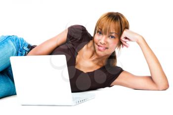 Royalty Free Photo of a Woman Lying on the Floor with a Laptop