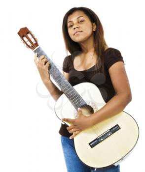 Royalty Free Photo of a Young Girl Holding a Guitar