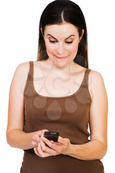 Royalty Free Photo of a Woman Text Messaging on her Cell Phone