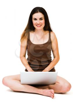 Royalty Free Photo of a Woman Sitting Down Holding a Laptop