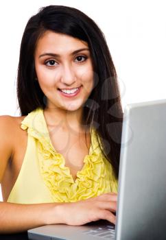 Royalty Free Photo of a Fashion Model Using a Laptop
