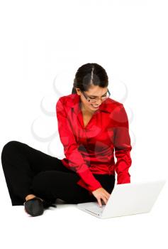 Royalty Free Photo of a Woman Sitting on the Floor Using a Laptop