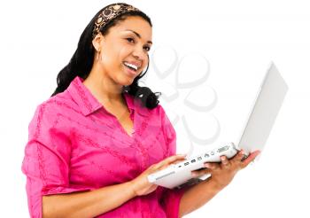 Royalty Free Photo of a Woman Smiling and Using her Laptop