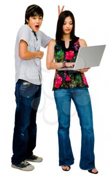 Royalty Free Photo of a Brother and Sister Using a Laptop 