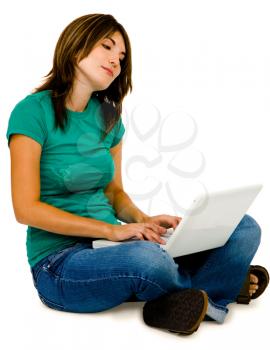 Royalty Free Photo of a Woman Sitting Down Using her Laptop