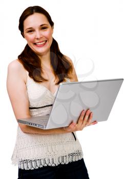 Royalty Free Photo of a Woman Smiling and Holding a Laptop