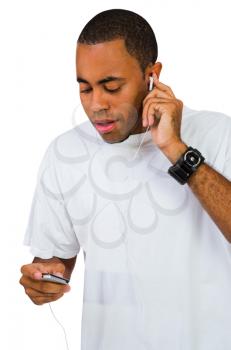 Royalty Free Photo of a Man Listening to Music on an Mp3 Player