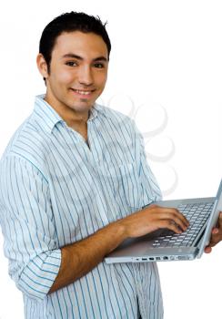 Royalty Free Photo of a Man Smiling and Holding a Laptop