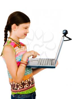 Royalty Free Photo of a Young Girl Using a Laptop