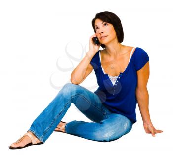 Royalty Free Photo of a Woman sitting on the Floor Talking on her Mobile Phone