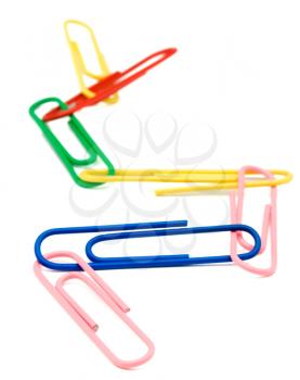 Paper clips linked together isolated over white