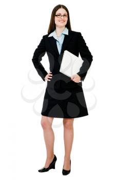 Businesswoman holding a laptop and smiling isolated over white