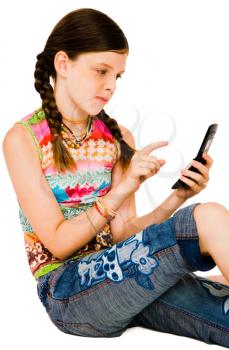 Child text messaging on a mobile phone isolated over white