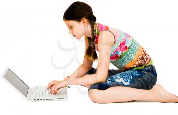 Close-up of a girl using a laptop and posing isolated over white