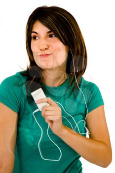 Close-up of a woman listening to music on a MP3 player isolated over white