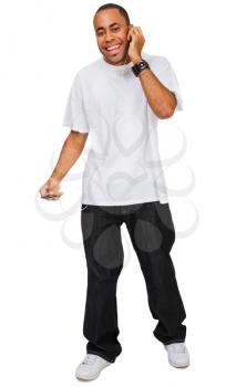 Happy man listening to music on a MP3 player isolated over white
