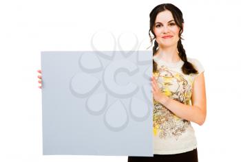 Beautiful woman holding a placard and posing isolated over white