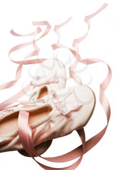 Two ballet slippers isolated over white