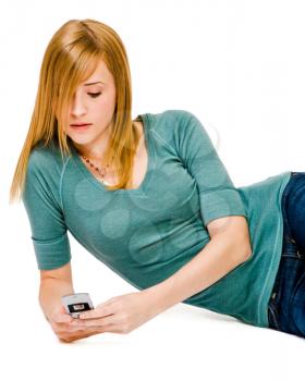 Close-up of a woman text messaging on a mobile phone isolated over white