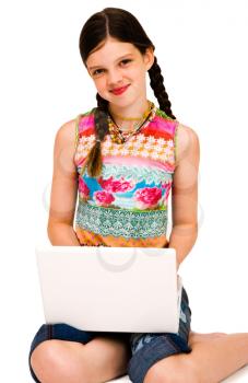 Portrait of a girl using a laptop and smiling isolated over white