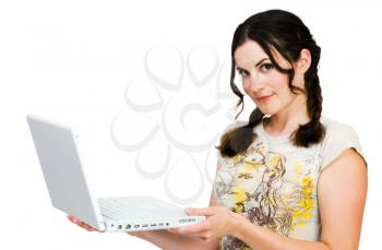 Smiling young woman holding a laptop isolated over white
