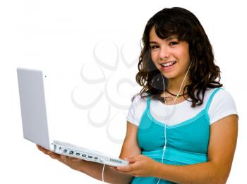 Close-up of a teenage girl listening to music on a laptop isolated over white