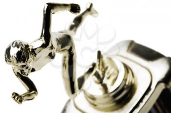 Close-up of an athletics trophy isolated over white