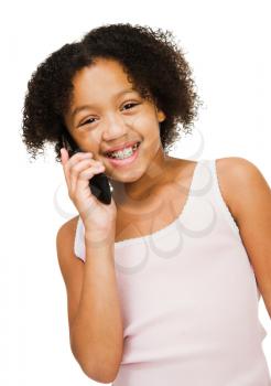 Girl talking on a mobile phone isolated over white