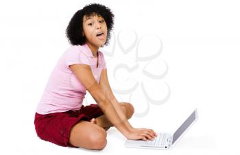 Fashion model using a laptop isolated over white