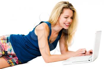 Close-up of a mid adult woman using a laptop isolated over white