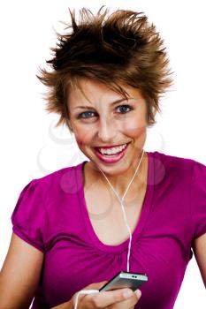 Portrait of a woman listening to music on a MP3 player isolated over white