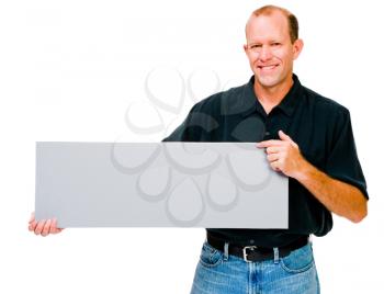 Confident man showing a placard isolated over white