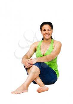 Fashion model sitting and smiling isolated over white