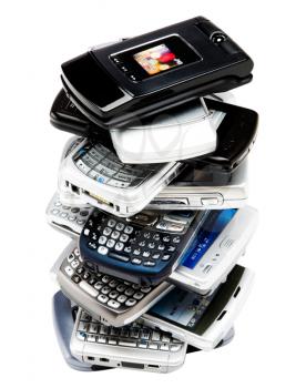 Mobile phones in a stack isolated over white