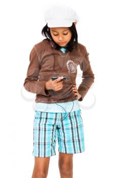 Girl listening to MP3 player with her hand on hip isolated over white
