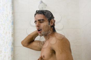 Close-up of a man taking a shower