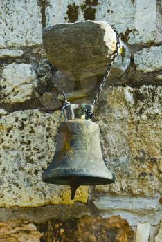 Bell hanging at a church wall, Church of The Holy Apostles, The Ancient Agora, Athens, Greece