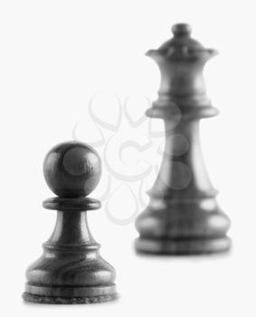 Close-up of a pawn with a queen