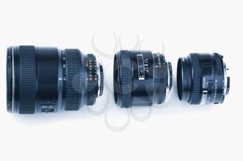 Three photographic lenses in a row