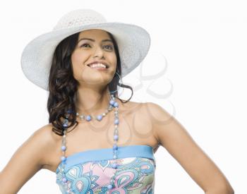 Female fashion model posing against white background