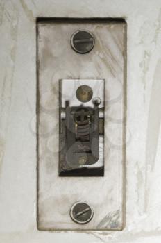 Close-up of a damaged door bell switch