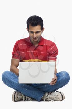 Close-up of a man using a laptop