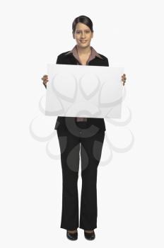 Businesswoman showing a placard and smiling