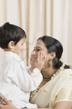 Woman loving with her son at home