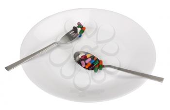 Assorted capsules in a plate