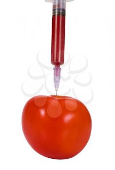 Tomato being injected with a syringe