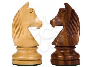 Close-up of chess knights face to face