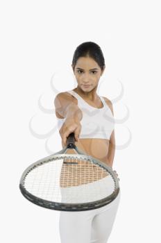 Portrait of a woman holding a tennis racket